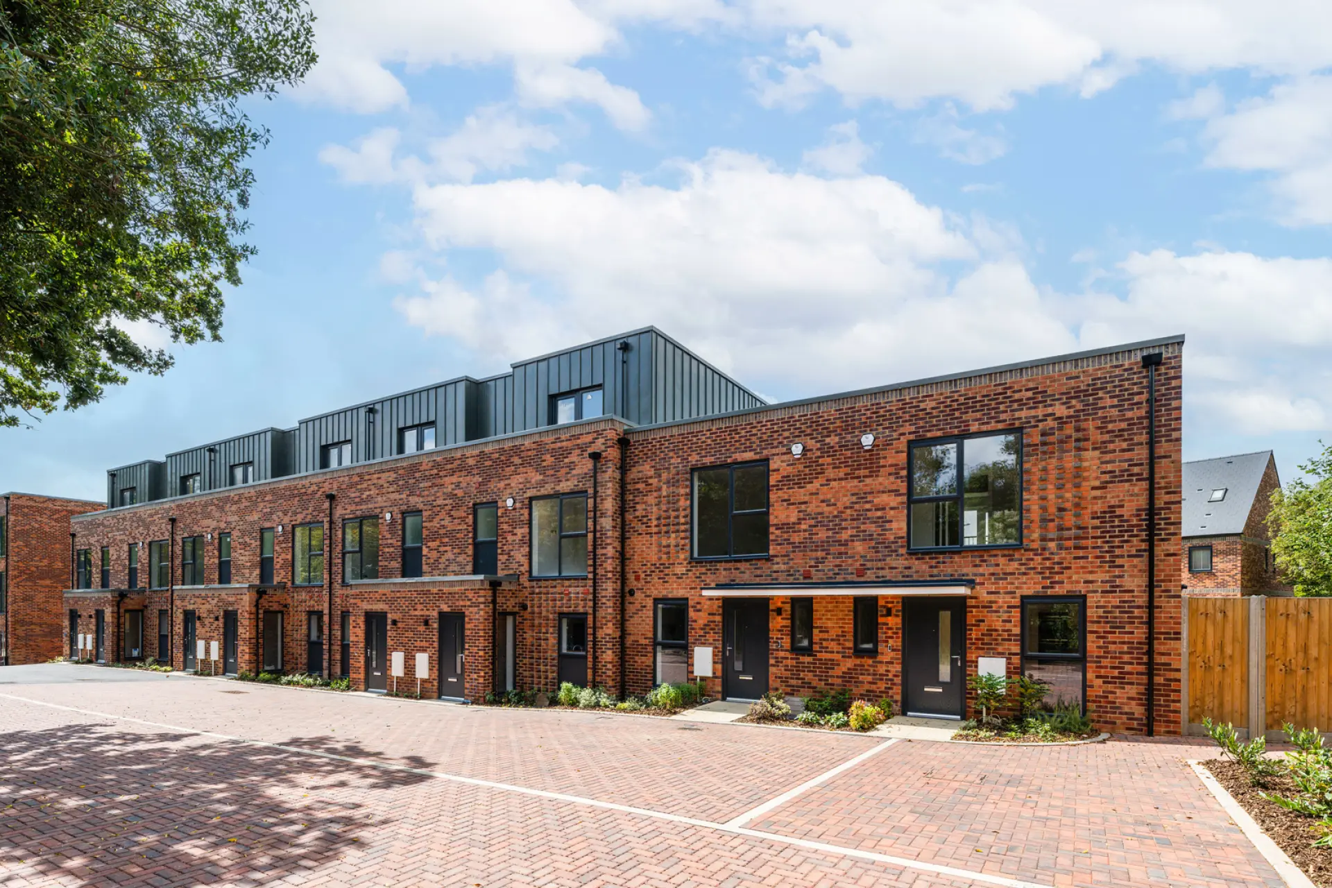 a brick building with a parking lot