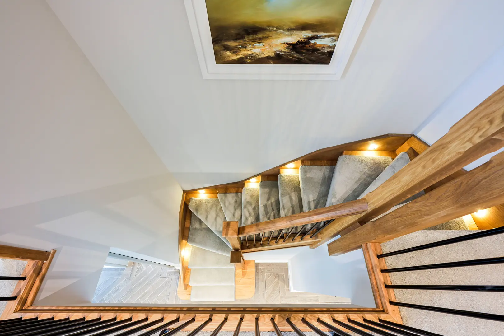 a staircase with lights on the top
