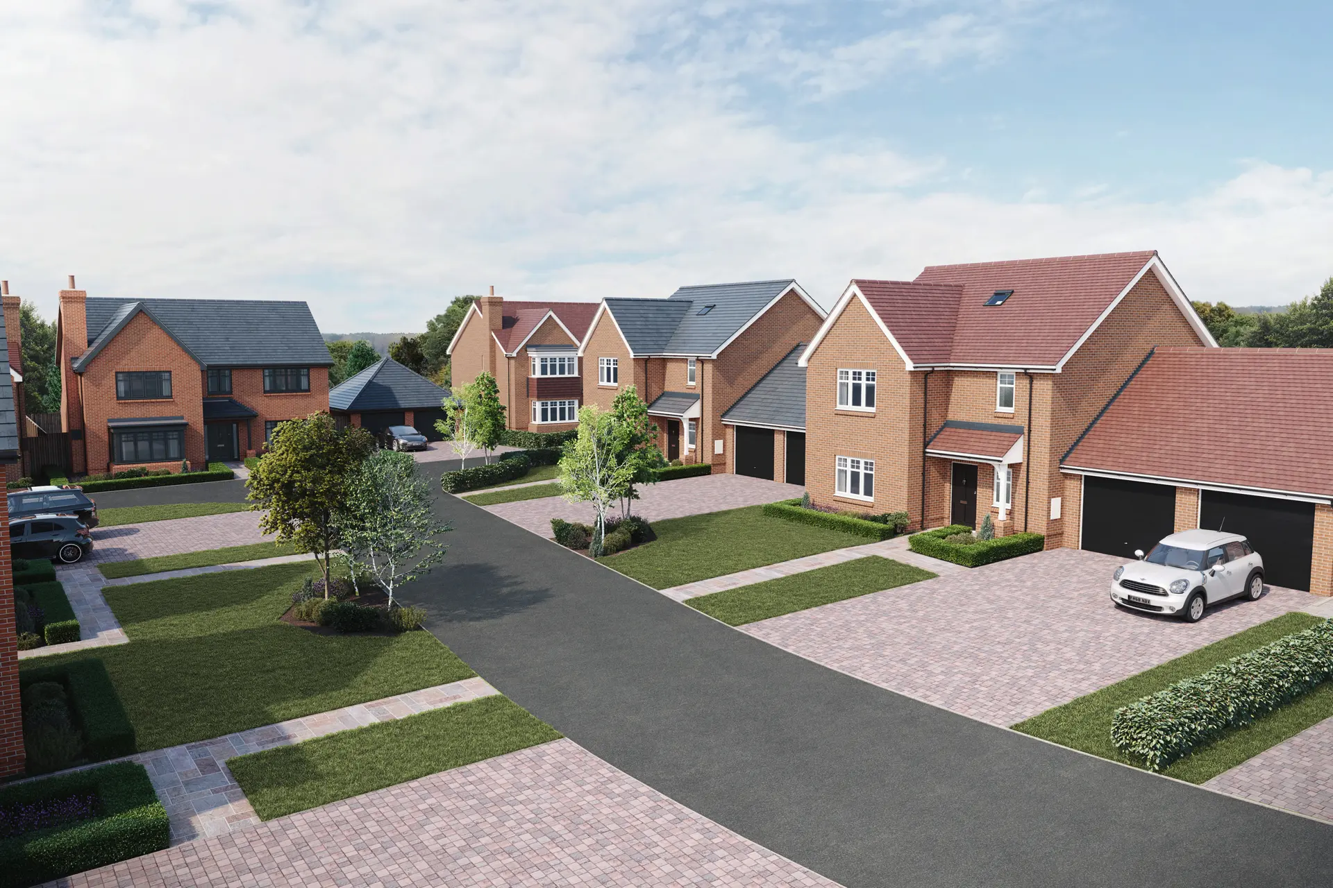 a group of houses with driveways and trees