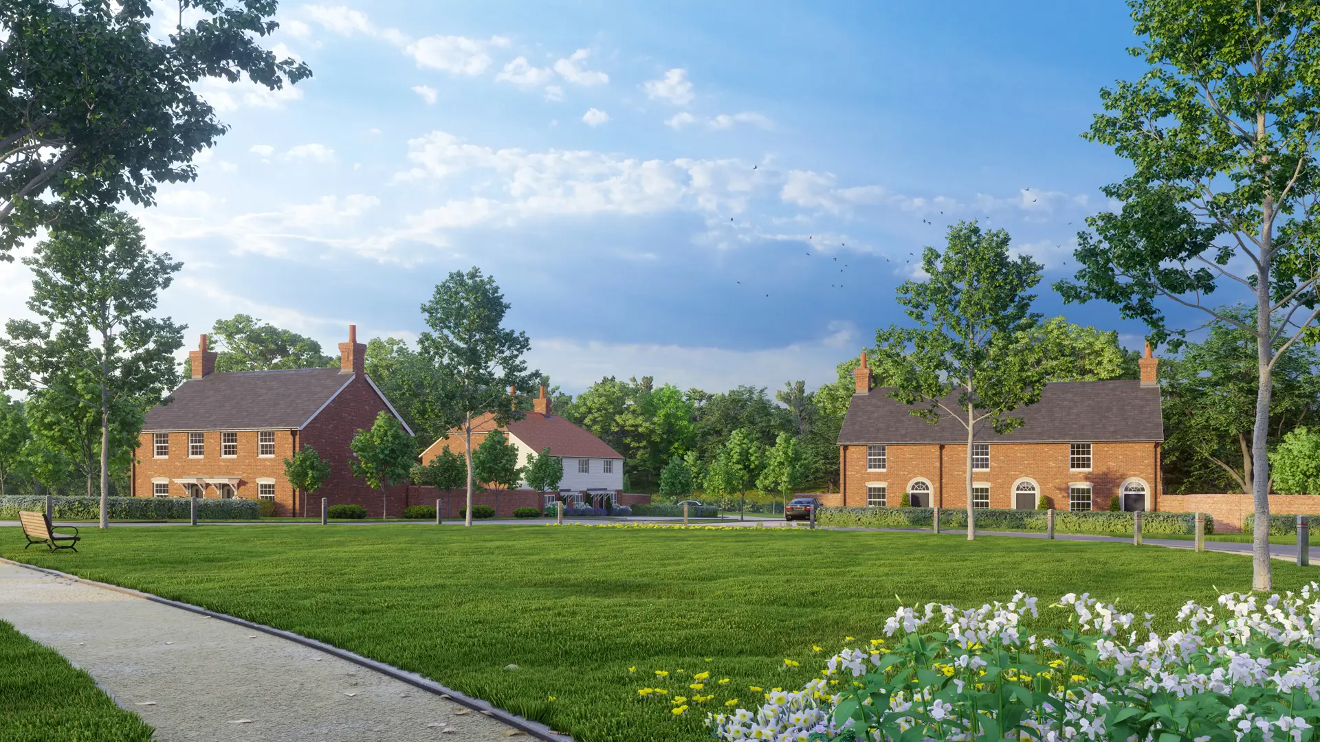a lawn with trees and houses in the background